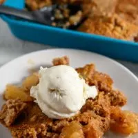 3 Ingredient Apple Dump Cake topped with ice cream.