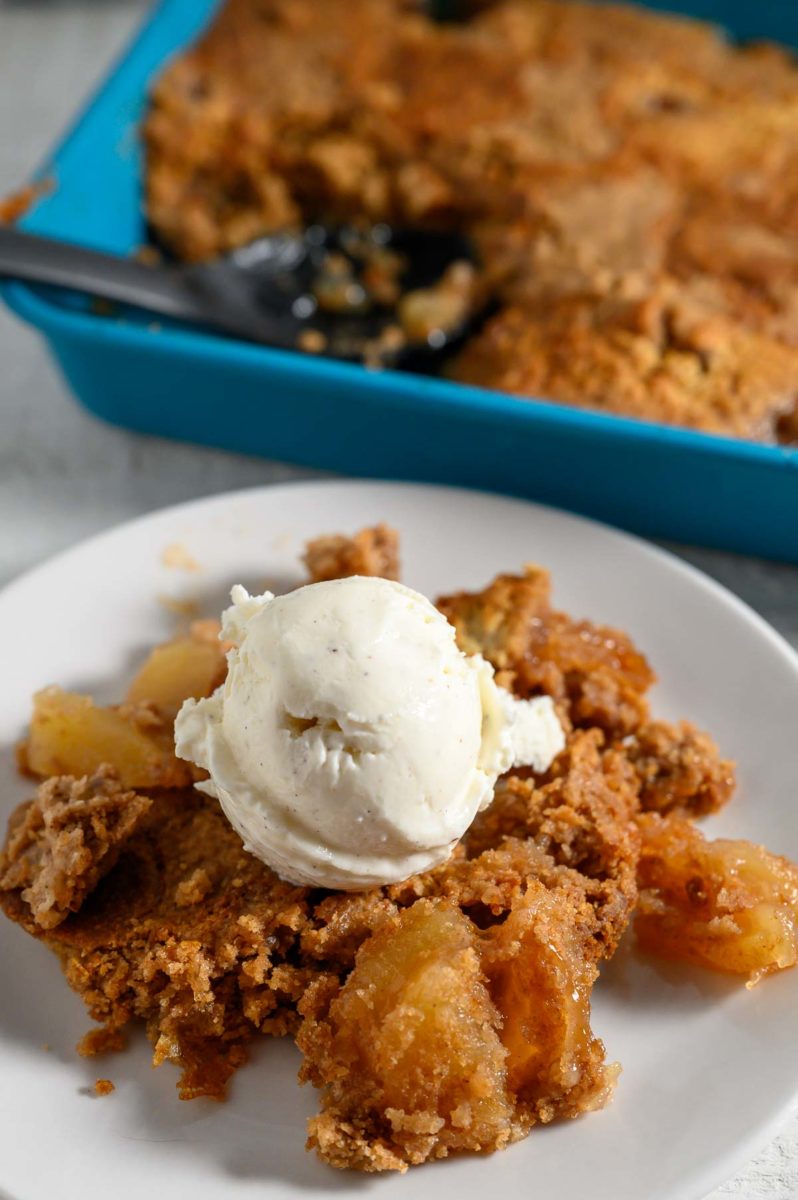 3 Ingredient Apple Dump Cake topped with ice cream.