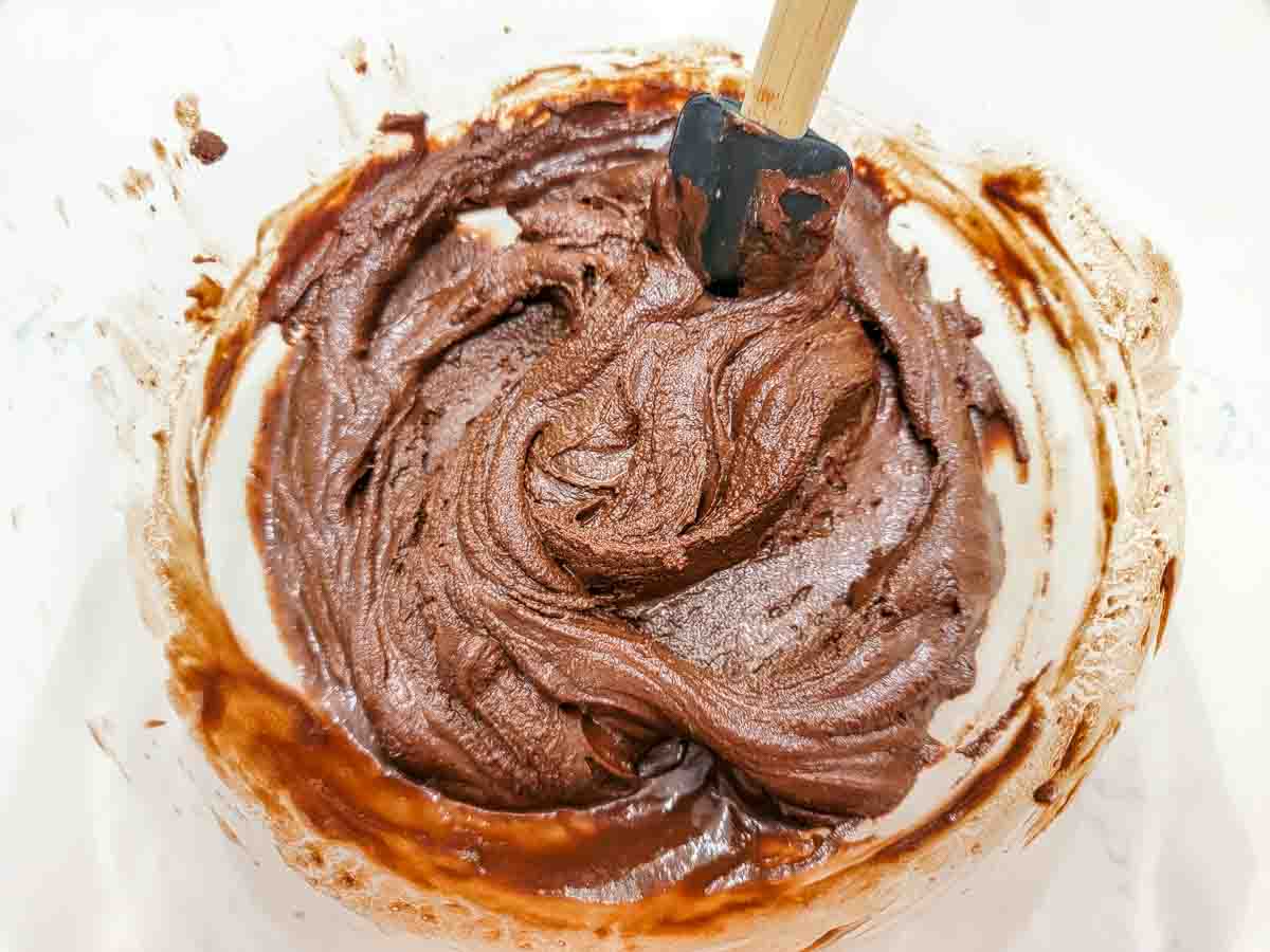 chocolate cheesecake batter in a mixing bowl.