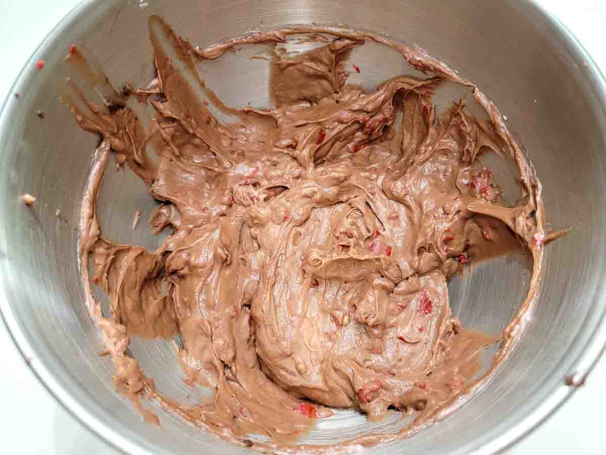 chocolate cherry cheesecake batter in a mixing bowl.