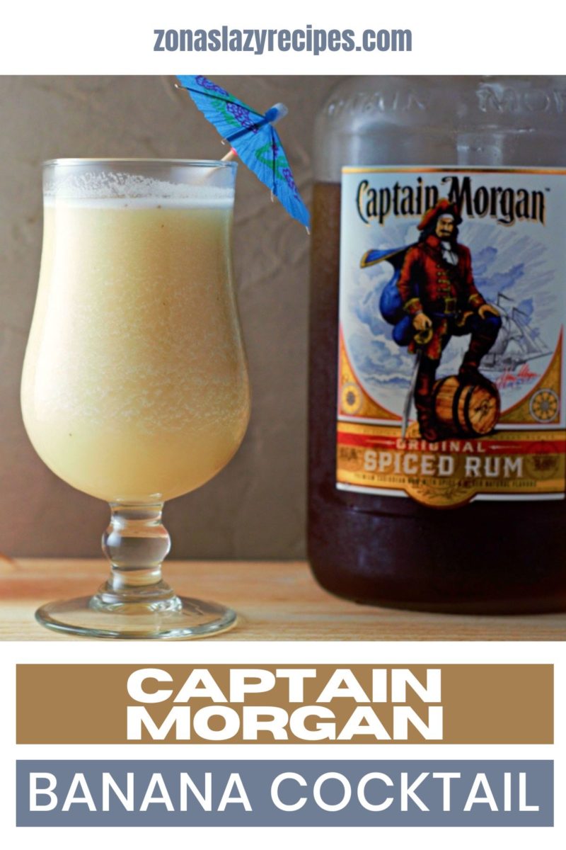 Captain Morgan Banana Cocktail in a glass next to a bottle of Captain Morgan Spiced Rum.