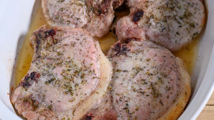 4 Ingredient Oven-baked Pork Chops in a casserole dish.