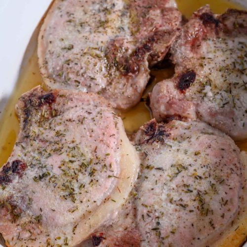 4 Ingredient Oven-baked Pork Chops in a baking dish.