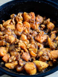 5 Ingredient Candied Sweet Potatoes in a cast iron skillet.