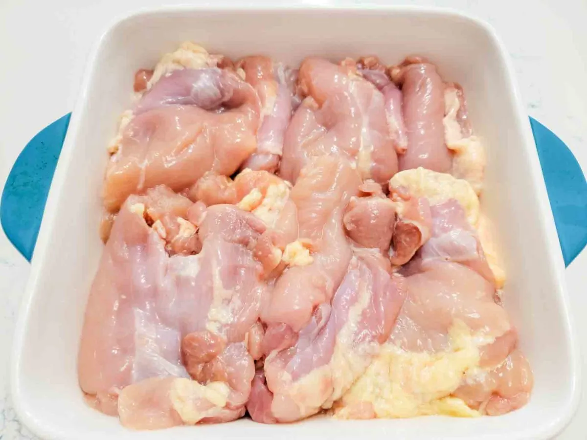 chicken thighs in a baking dish.