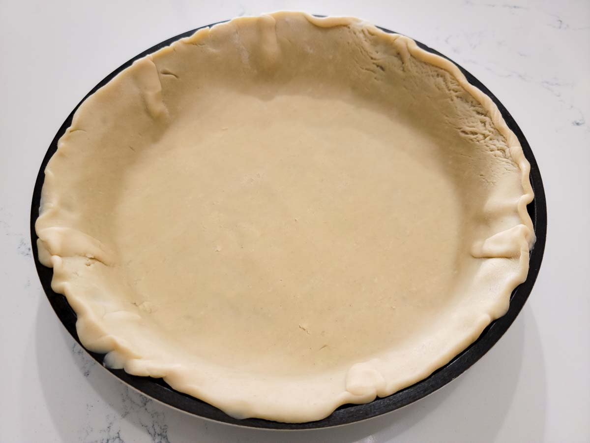 pie dough in a pie pan.