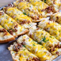 Ground Beef and Garlic Bread Recipe on a baking sheet.