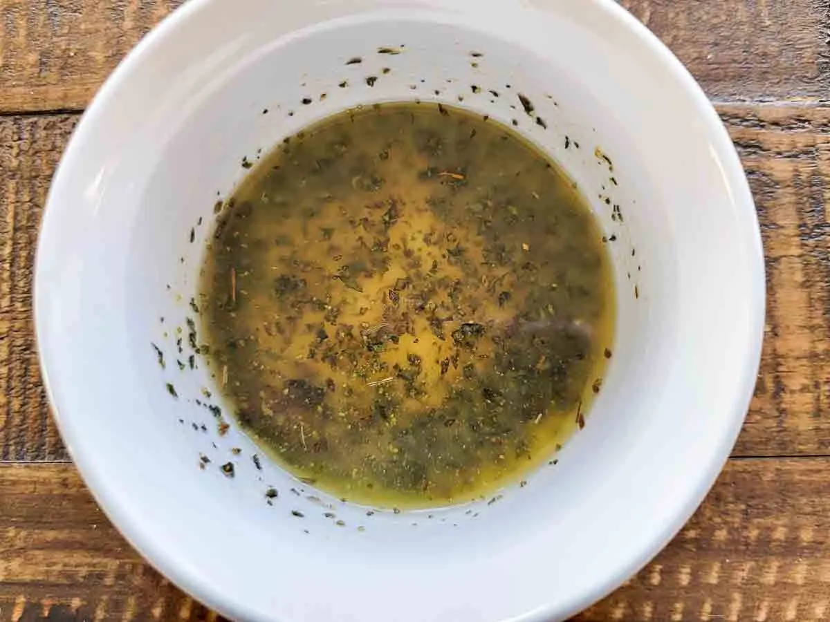 melted butter, garlic powder, coarse salt, and oregano in a small bowl.