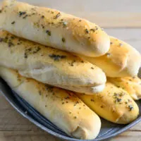 6 Ingredient Italian Breadsticks in a bread tray.