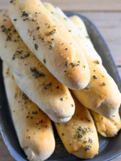 6 Ingredient Italian Breadsticks in a bread tray.