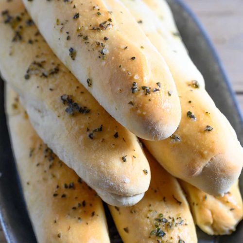 6 Ingredient Italian Breadsticks in a bread tray.