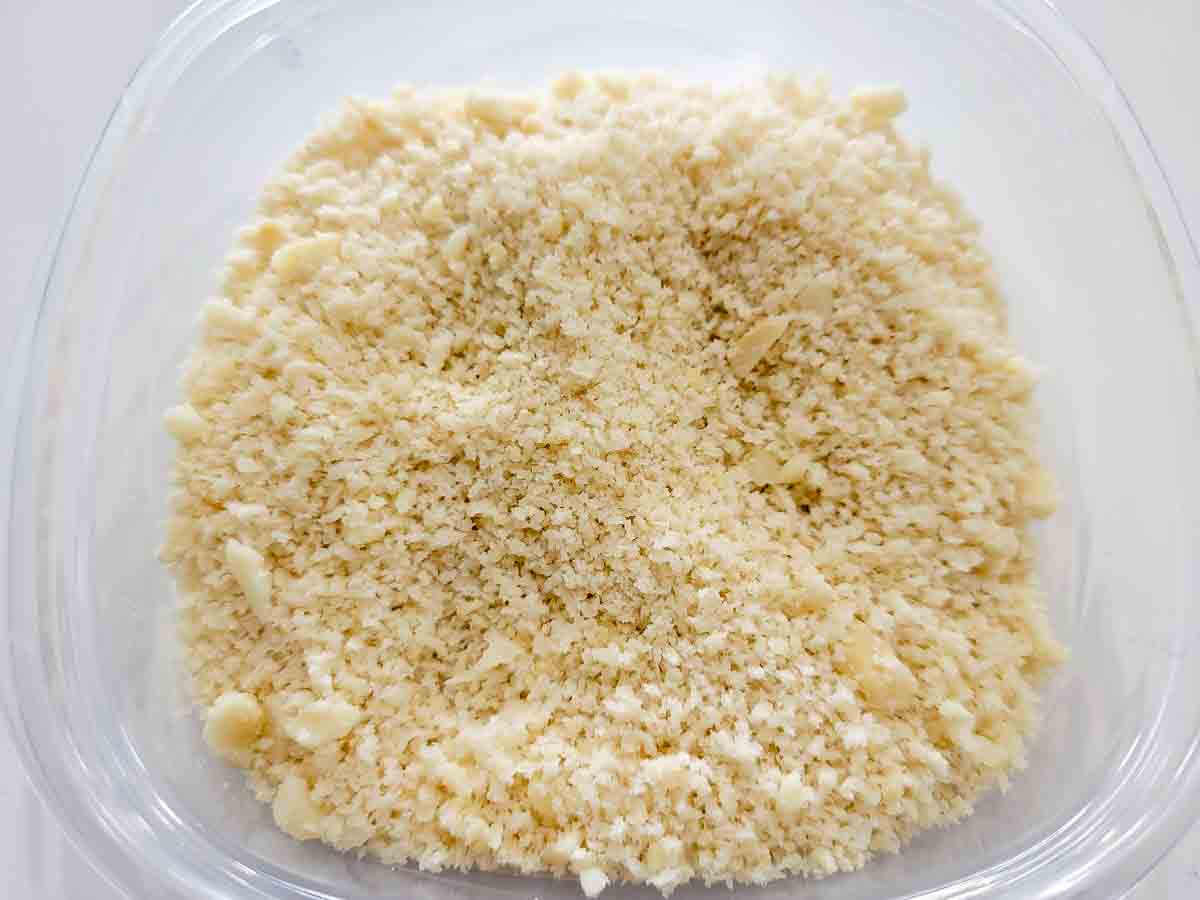panko bread crumbs mixed with chopped macadamia nuts in a bowl.