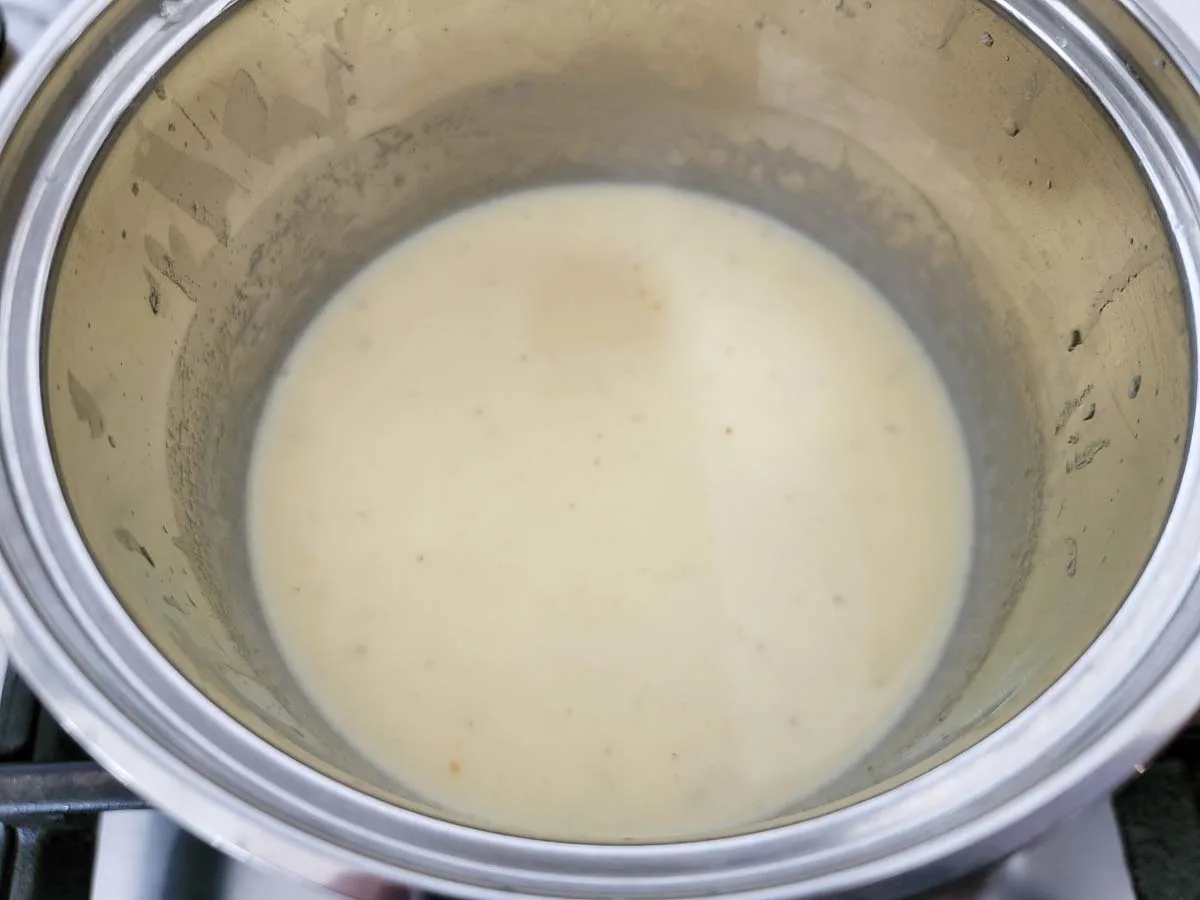 honey brown butter cream sauce cooking in a pan.