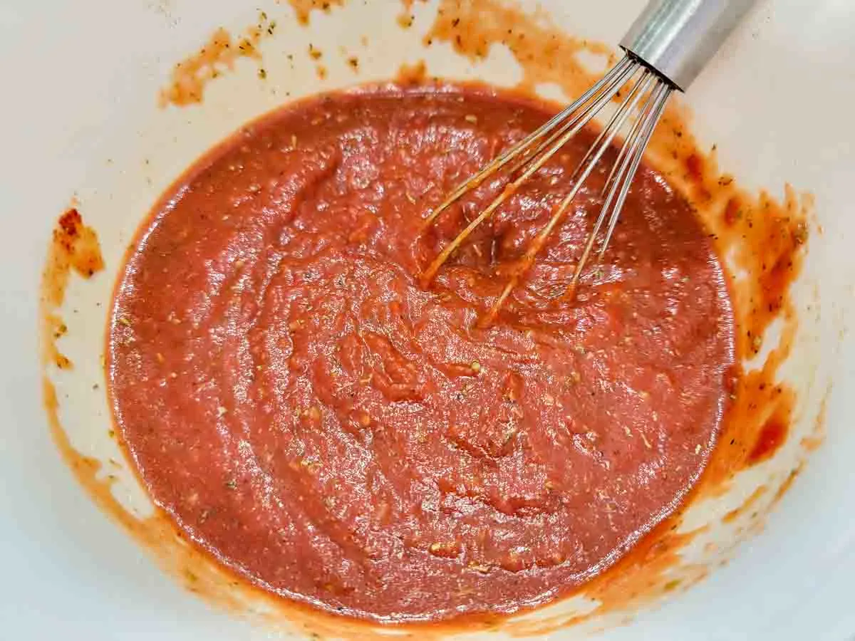 5 Minute Pizza Sauce whisked in a bowl.