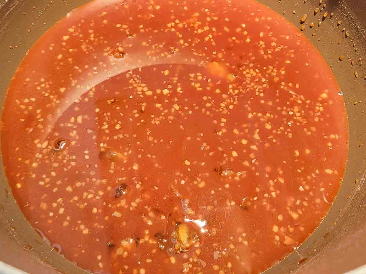 orange juice, orange marmalade, jarred minced garlic, soy sauce, and cornstarch in a large Dutch oven pan.