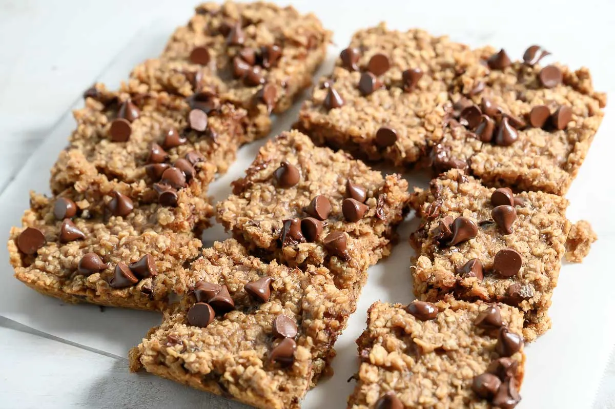 Banana Oat Bars squares on parchment paper.