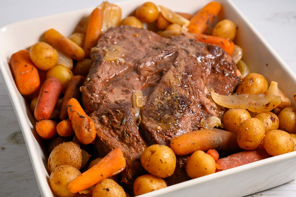 Easy Slow Cooker Pot Roast and Veggies in a dish.