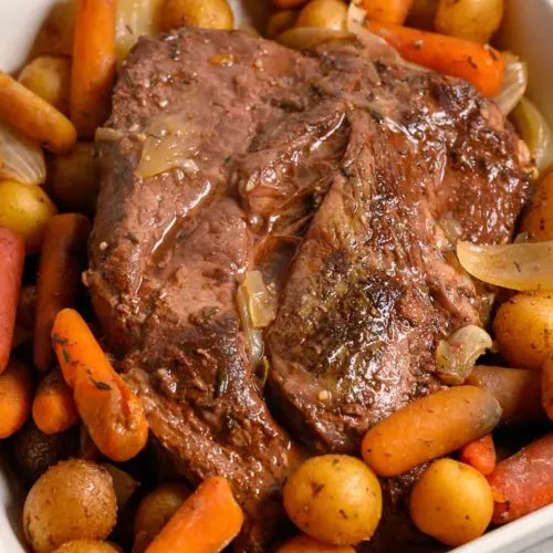 Easy Slow Cooker Pot Roast and Veggies in a dish.