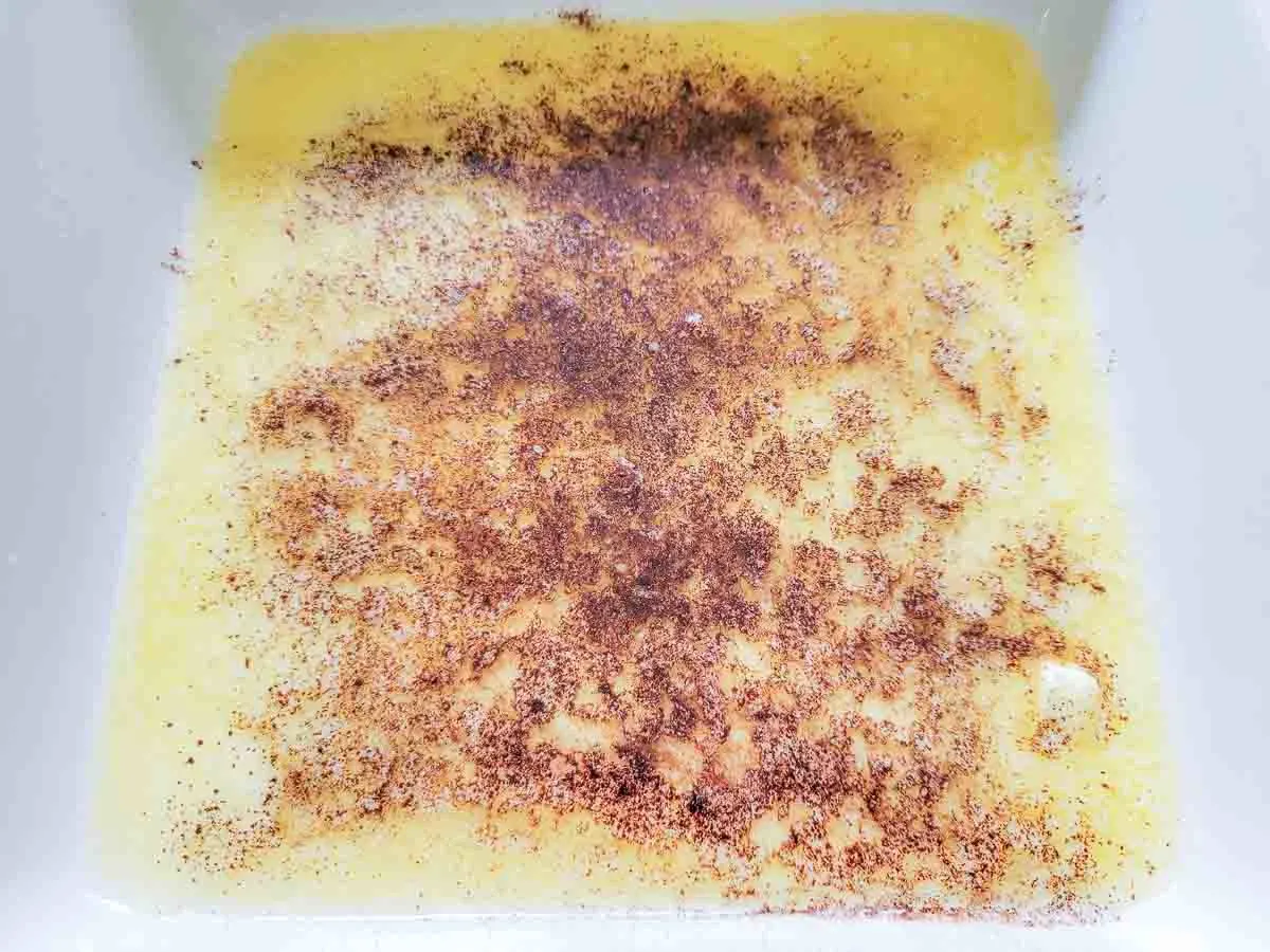 melted butter and cinnamon in a baking dish.