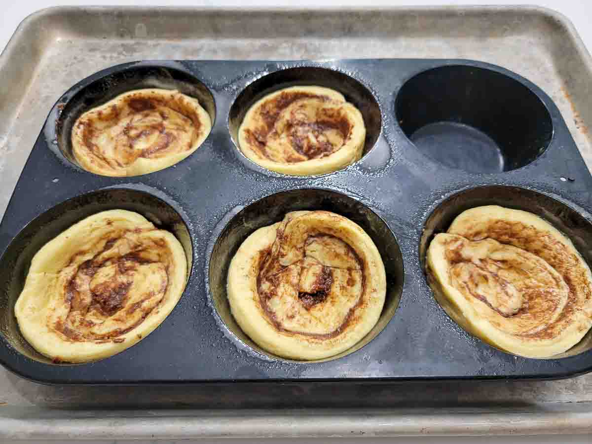 jumbo cinnamon rolls pressed into a jumbo muffin pan.