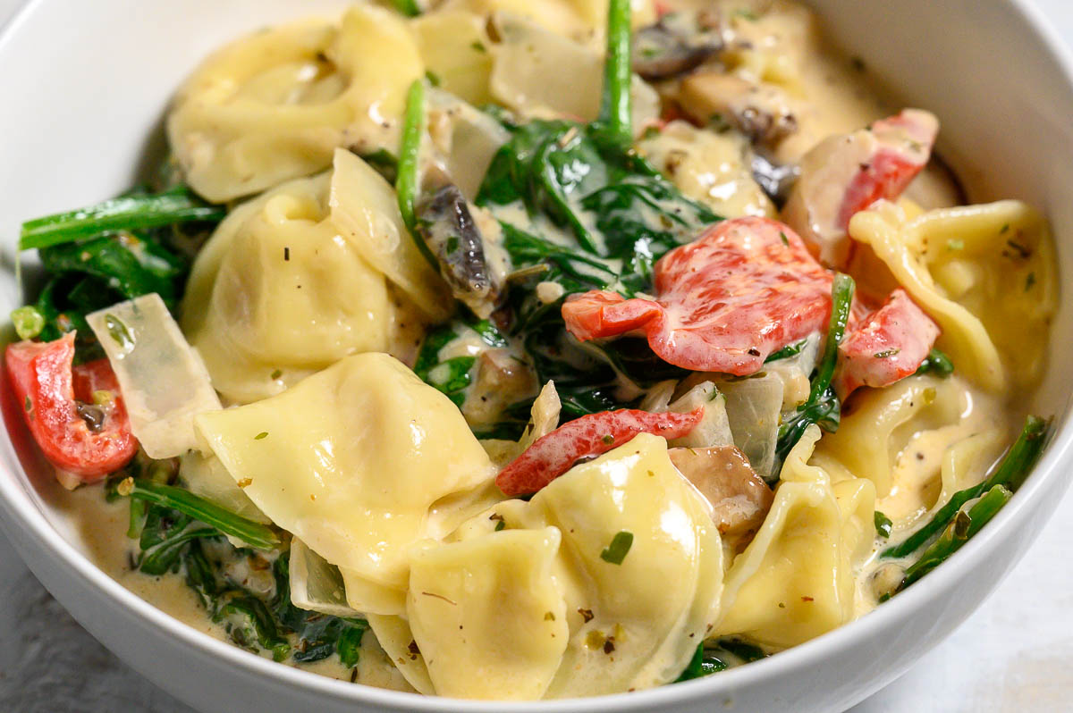 Garlic Tortellini Tuscan Soup in a bowl.