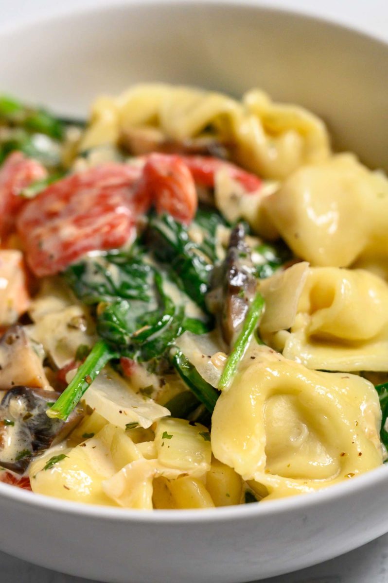 Garlic Tortellini Tuscan Soup in a serving dish.