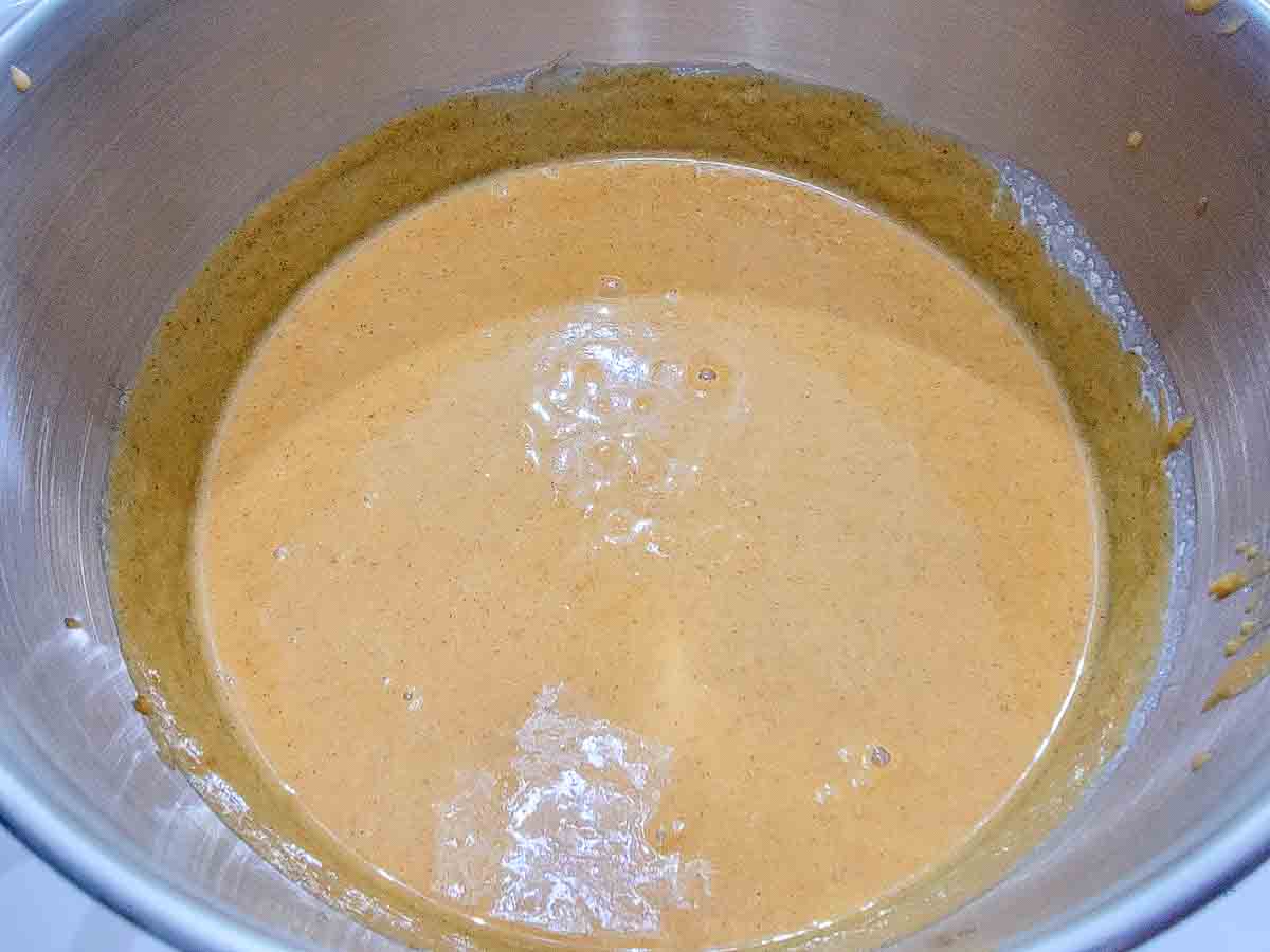 heavy cream, canned pumpkin, sugar, eggs, pumpkin pie spice, salt, and vanilla extract mixed in a bowl.