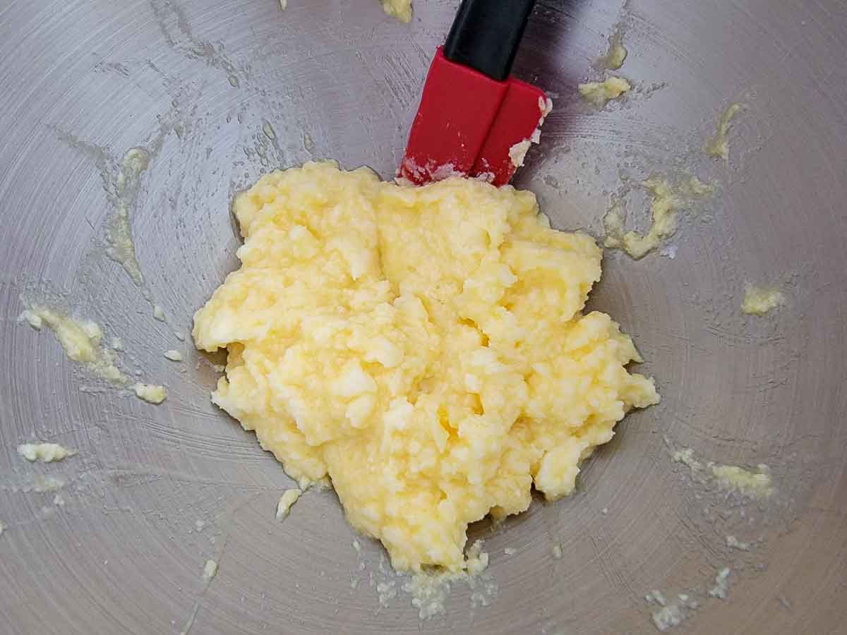 butter, sugar, egg, and vanilla mixed in a bowl.