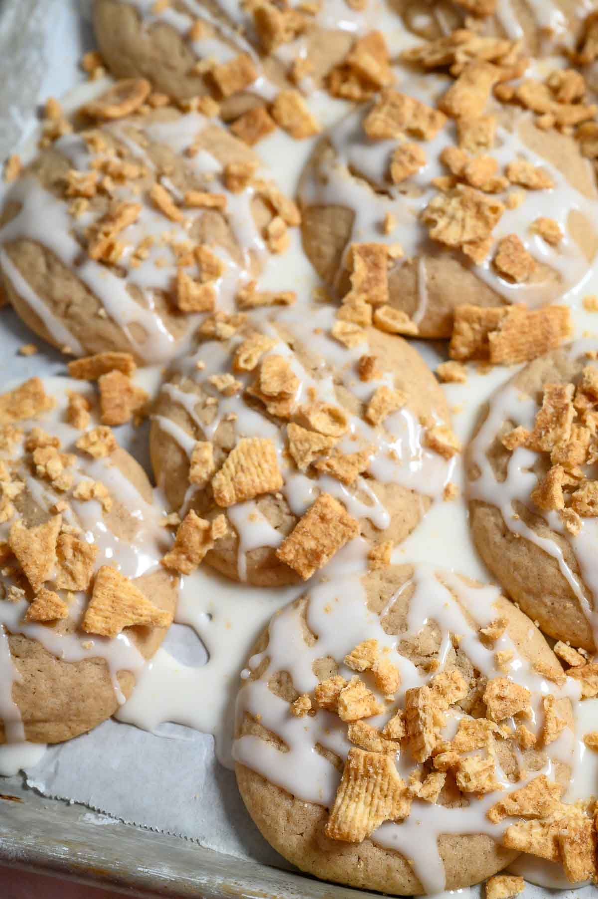 Cinnamon Toast Crunch cookies on a cookie sheet.