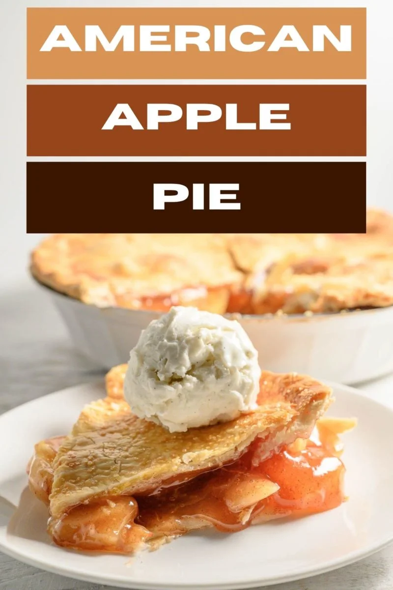 slice of American apple pie topped with ice cream.