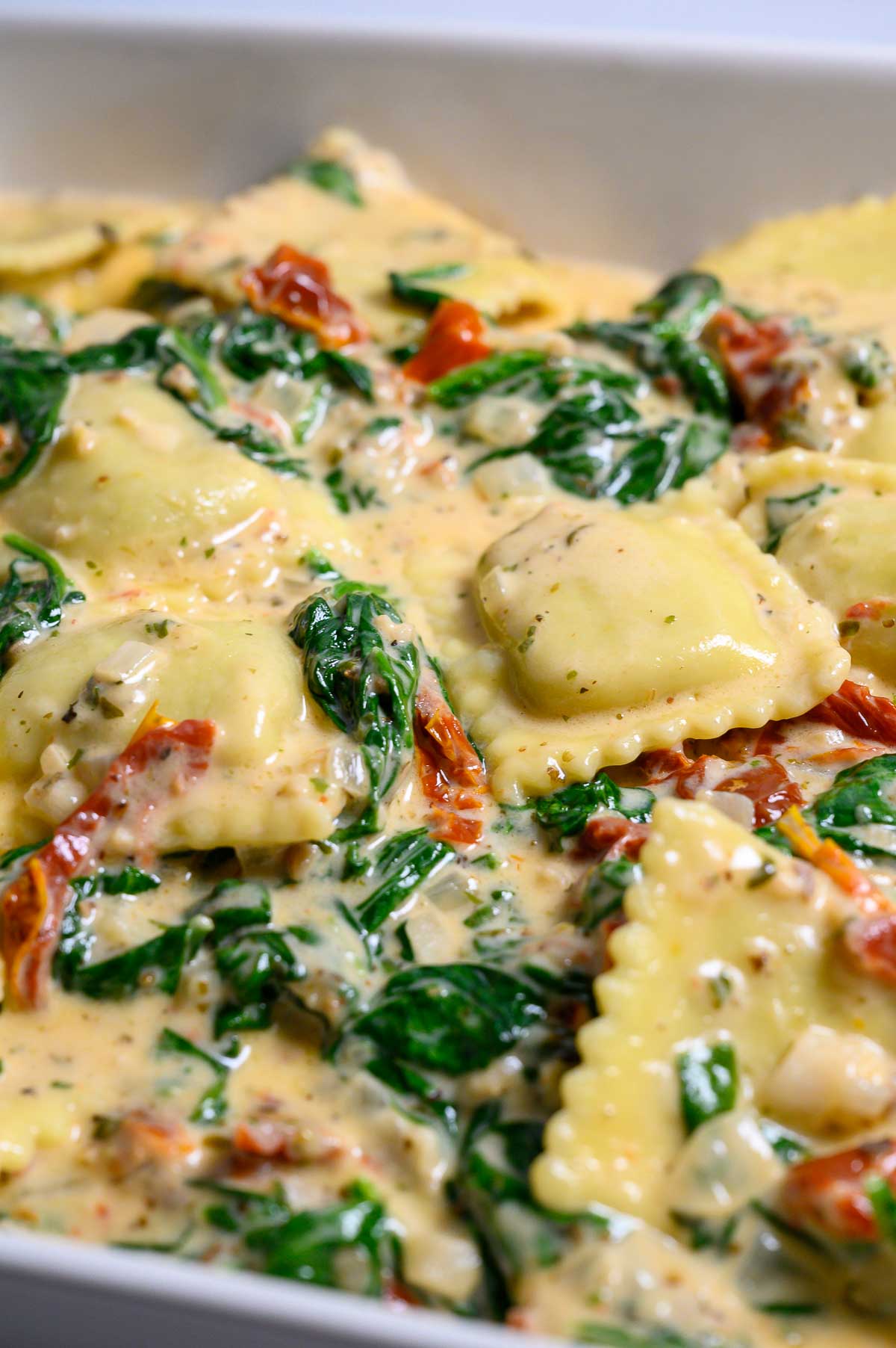 Creamy Tuscan Ravioli in a dish.